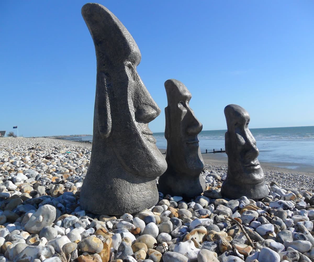 Set of three Easter Island heads in reconstituted stone