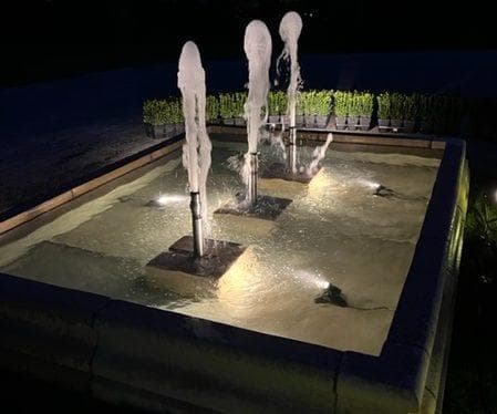 A large square pool surround with display pumps running